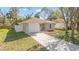 Charming single-story home with a well-maintained lawn and a paved driveway at 811 Niles St, Daytona Beach, FL 32114