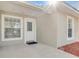 Well-lit front entrance featuring a white door and nearby window at 811 Niles St, Daytona Beach, FL 32114