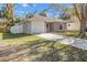 A single-story home features a driveway and a one car garage at 811 Niles St, Daytona Beach, FL 32114