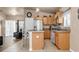 Bright kitchen featuring tile flooring, stainless steel appliances, and a breakfast bar area at 811 Niles St, Daytona Beach, FL 32114