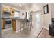 Open kitchen featuring stainless steel appliances, a breakfast bar, and neutral finishes at 811 Niles St, Daytona Beach, FL 32114