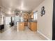 Bright kitchen featuring tile flooring, stainless steel appliances, and a breakfast bar area at 811 Niles St, Daytona Beach, FL 32114
