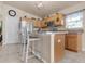 Bright kitchen featuring granite countertops, stainless appliances, and island with breakfast bar at 811 Niles St, Daytona Beach, FL 32114