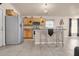 Modern kitchen featuring stainless steel appliances, a breakfast bar, and ample cabinet space at 811 Niles St, Daytona Beach, FL 32114