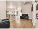 Open-concept living room with wood floors, modern furnishings, and seamless flow to the kitchen at 811 Niles St, Daytona Beach, FL 32114