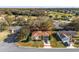 A lovely aerial shot showcasing the property's manicured lawn and proximity to the golf course at 8740 Se 140Th Place Rd, Summerfield, FL 34491