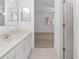 Bathroom features a tiled floor and vanity with sink at 8740 Se 140Th Place Rd, Summerfield, FL 34491