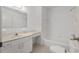 Clean bathroom features a vanity with sink and tub with shower at 8740 Se 140Th Place Rd, Summerfield, FL 34491