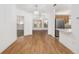 Bright dining room features hardwood floors and updated light fixtures at 8740 Se 140Th Place Rd, Summerfield, FL 34491