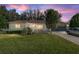 Charming single-story home featuring a well-manicured lawn, classic architectural details, and inviting curb appeal at 8740 Se 140Th Place Rd, Summerfield, FL 34491