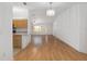 Inviting open-concept living space with wood floors and bright natural light at 8740 Se 140Th Place Rd, Summerfield, FL 34491