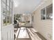 Covered outdoor patio perfect for grilling and entertaining at 8740 Se 140Th Place Rd, Summerfield, FL 34491