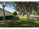 A beautiful lawn surrounded by mature trees that provide shade and a curb at 8740 Se 140Th Place Rd, Summerfield, FL 34491