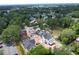 Aerial view of new homes under construction surrounded by lush greenery in a neighborhood at 912 Se 6Th St, Ocala, FL 34471