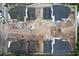 Birds eye view of multiple houses in a construction zone with various construction materials and equipment at 912 Se 6Th St, Ocala, FL 34471