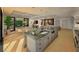Modern kitchen with granite countertops, island with seating, and open layout to the dining and living areas at 912 Se 6Th St, Ocala, FL 34471