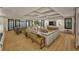 Open-concept living room boasts hardwood floors, coffered ceilings, and a modern design that is perfect for entertaining at 912 Se 6Th St, Ocala, FL 34471