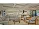 Open-concept living area with modern decor, hardwood floors, and seamless connection to the kitchen and dining space at 912 Se 6Th St, Ocala, FL 34471