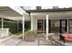 Charming patio with outdoor seating, built-in grill, and a serene view of the manicured backyard at 912 Se 6Th St, Ocala, FL 34471