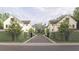 A row of new construction houses behind a fence with manicured greenery on either side of the street at 912 Se 6Th St, Ocala, FL 34471