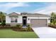 Charming single-story home with a two-car garage, neutral siding, stone accents, and well-maintained landscaping at 9356 Sw 60Th Court Rd, Ocala, FL 34476