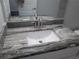Modern bathroom sink with granite counter and stainless steel fixtures at 9455 Se 152Nd Pl, Summerfield, FL 34491