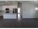 Modern kitchen featuring white cabinets, stainless steel appliances, and a large island at 9455 Se 152Nd Pl, Summerfield, FL 34491