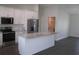 Modern kitchen with stainless steel appliances, marble countertops, and white cabinets at 9455 Se 152Nd Pl, Summerfield, FL 34491