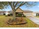 Charming single-story home featuring a well-maintained yard with mature tree at 9710 Sw 96Th St, Ocala, FL 34481