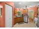 Functional kitchen featuring wood cabinets and stainless steel appliances at 9710 Sw 96Th St, Ocala, FL 34481