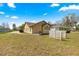 Spacious backyard featuring a screened patio, lush green lawn and mature landscaping at 11267 Sw 51St Ave, Ocala, FL 34476