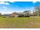 Spacious backyard with a screened-in patio and well-maintained lawn at 11267 Sw 51St Ave, Ocala, FL 34476