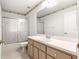 Bathroom featuring a shower with sliding glass doors and white vanity at 11267 Sw 51St Ave, Ocala, FL 34476