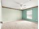 Spacious bedroom with neutral carpet and a ceiling fan for added comfort at 11267 Sw 51St Ave, Ocala, FL 34476