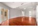 Spacious bedroom with hardwood floors, recessed ceiling, and sliding doors to the lanai at 11267 Sw 51St Ave, Ocala, FL 34476