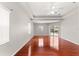 Spacious bedroom with wood floors, recessed ceiling, and sliding doors to the lanai at 11267 Sw 51St Ave, Ocala, FL 34476