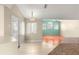 Dining area with access to the outdoor patio and the living room at 11267 Sw 51St Ave, Ocala, FL 34476