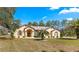 Charming single story home with stucco siding, shuttered windows, and mature landscaping at 11267 Sw 51St Ave, Ocala, FL 34476