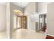 Entrance foyer with tile flooring, high ceilings, and transom window above door at 11267 Sw 51St Ave, Ocala, FL 34476