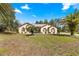 Charming home featuring a well-kept lawn, mature palm trees and inviting curb appeal at 11267 Sw 51St Ave, Ocala, FL 34476
