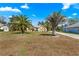 Inviting home exterior with mature palm trees and landscaping enhancing the curb appeal at 11267 Sw 51St Ave, Ocala, FL 34476