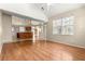Open-concept living room with hardwood floors and large windows that provide natural light at 11267 Sw 51St Ave, Ocala, FL 34476