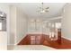 Open concept living room with wood floors and large windows at 11267 Sw 51St Ave, Ocala, FL 34476