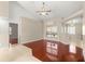 Bright open-concept living space featuring hardwood floors, ceiling fan, and natural light at 11267 Sw 51St Ave, Ocala, FL 34476