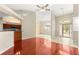 Open-concept floor plan with hardwood and tile floors, leading to the kitchen at 11267 Sw 51St Ave, Ocala, FL 34476