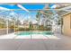 Screened-in pool area with a refreshing pool and patio space for relaxation at 11267 Sw 51St Ave, Ocala, FL 34476