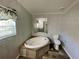 A well-lit bathroom featuring a modern bathtub and updated fixtures at 11644 Nw 21St St, Ocala, FL 34482