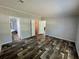 A spacious bedroom with wood-look flooring and a walk-in closet offers ample storage at 11644 Nw 21St St, Ocala, FL 34482