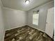 Cozy bedroom features a window offering natural light and wood-look flooring at 11644 Nw 21St St, Ocala, FL 34482