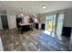 Modern kitchen featuring a large island with seating, stainless steel appliances, and updated cabinets at 11644 Nw 21St St, Ocala, FL 34482